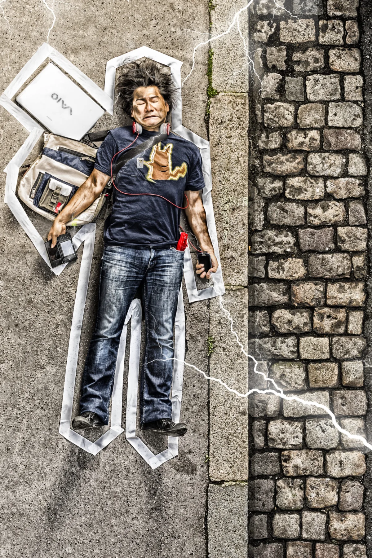 A man lies on cobblestones inside a chalk outline, struck by drawn lightning