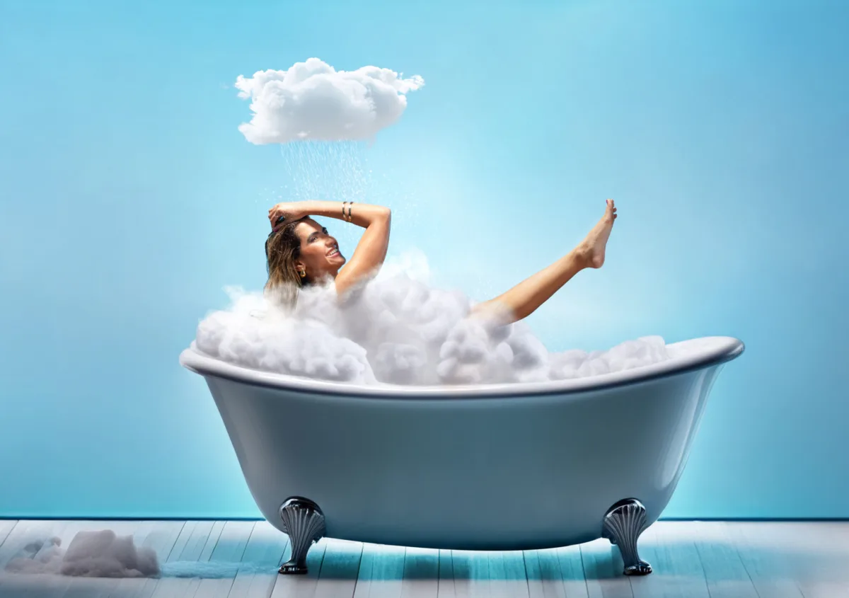 A woman lounges in a vintage bathtub filled with clouds