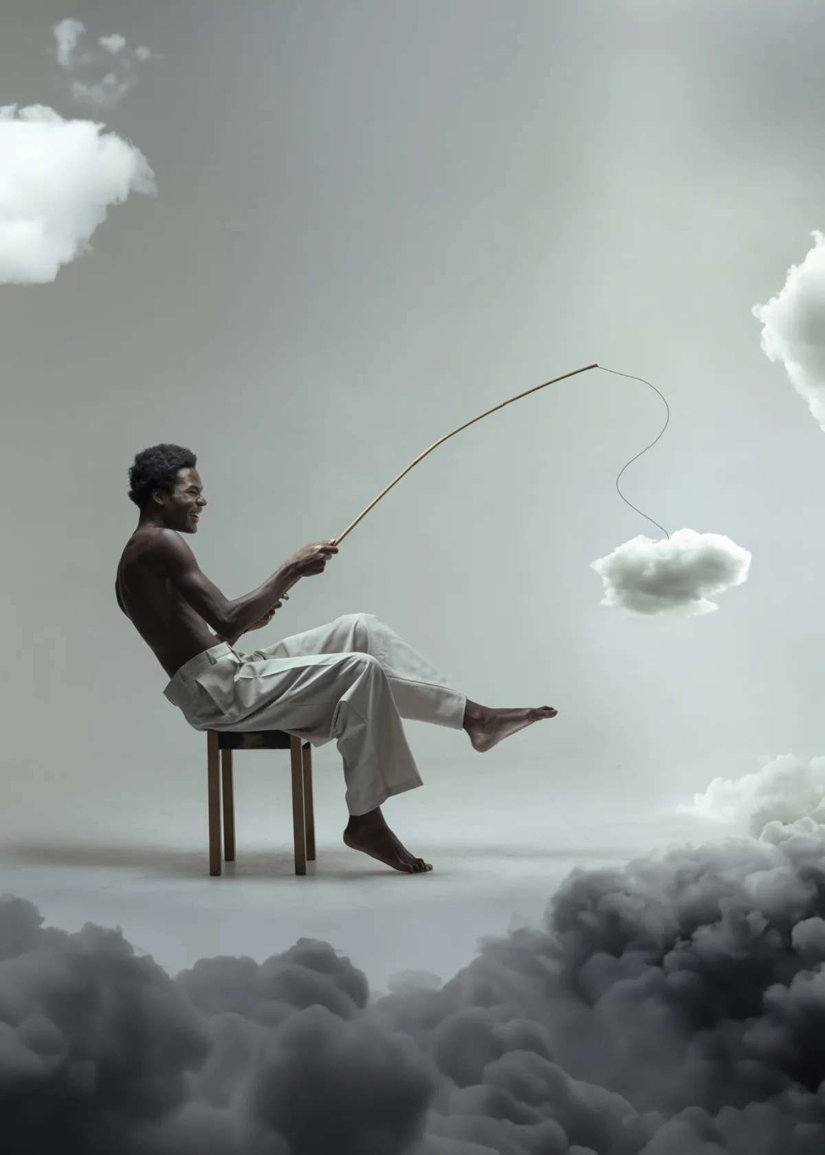 A man on a stool fishes a small cloud out of the sky